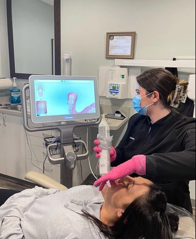 patient at Kanellis Family Dentistry receiving an oral examination