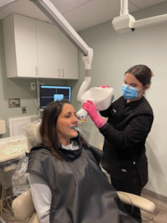 patient of Kanellis Family Dentistry receiving dental care by staff member