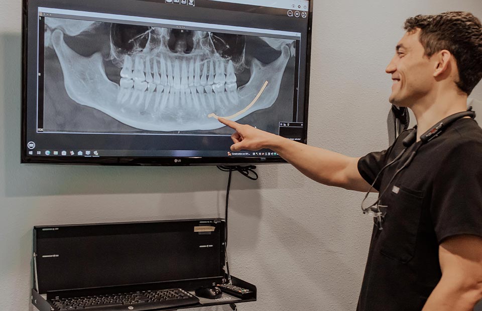 Sparks, NV dentist Dr. Kanellis reviewing a patient's dental x-rays